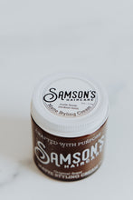 Load image into Gallery viewer, 4 oz Matte Styling Cream photographed at an elevated angle to highlight the lid's top.