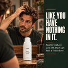 Man running a hand through hair styled with Samson's Volumizing Matte Powder: matte texture and lift, like you have nothing in it