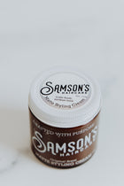 4 oz Matte Styling Cream photographed at an elevated angle to highlight the lid's top.