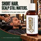 Barber working Samson's Daily Nourishing Conditioner into a client's short hair at the shampoo bowl. Short hair, scalp still matters