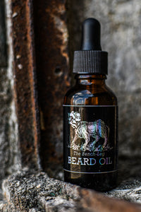 1 oz Beard Oil with new Bench-Leg logo, displayed on a weathered, rusted ledge.