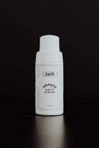 1.4 oz Volumizing Matte Powder bottle with black background.
